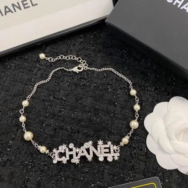 Chanel Jewelry | Pearl Strand with Integrated Crystal-Encrusted Logo