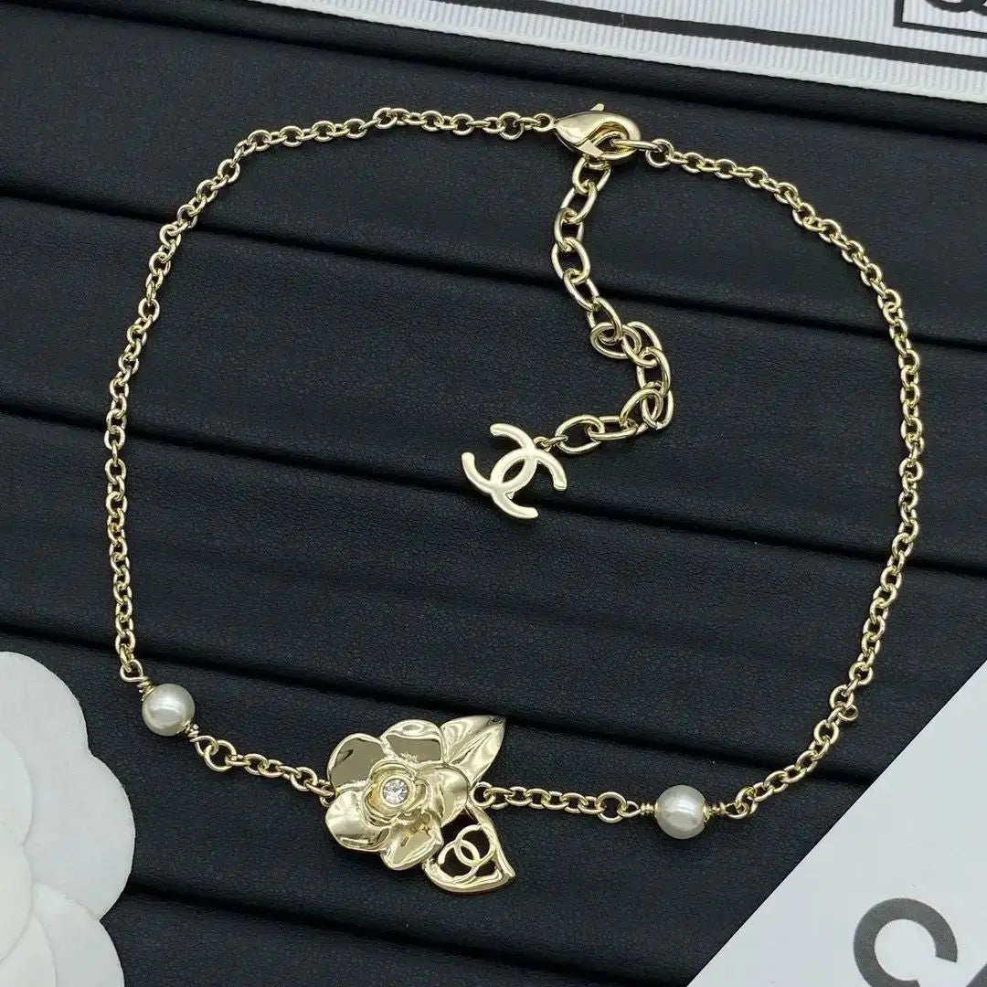 Chanel Jewelry | Camélia CC Logo Pearl Collection
